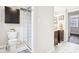 Well-lit bathroom featuring a tiled shower, modern fixtures, and tiled floors at 455 Meadowview Ln, Greenwood, IN 46142