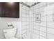 Shower with white tiled walls, black mosaic trim, and built-in niche at 455 Meadowview Ln, Greenwood, IN 46142
