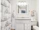 Bright bathroom with a decorative ship-themed shower curtain and modern vanity at 455 Meadowview Ln, Greenwood, IN 46142