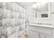 Ship-themed shower curtain, a modern vanity, and sleek design in the bathroom at 455 Meadowview Ln, Greenwood, IN 46142
