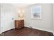 Cozy bedroom with hardwood floors, a side table, and a bright window at 455 Meadowview Ln, Greenwood, IN 46142