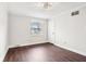 Bright bedroom with hardwood floors, white walls, and a modern ceiling fan at 455 Meadowview Ln, Greenwood, IN 46142