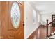 The front entryway features a decorative wood door and hardwood flooring at 455 Meadowview Ln, Greenwood, IN 46142
