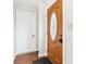 The front entryway features a decorative wood door and hardwood flooring at 455 Meadowview Ln, Greenwood, IN 46142