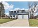 Inviting two-story home featuring a spacious driveway and neat front yard at 455 Meadowview Ln, Greenwood, IN 46142
