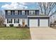 Charming two-story home with a well-manicured lawn and two-car garage at 455 Meadowview Ln, Greenwood, IN 46142