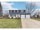 Two-story home with blue and white exterior, two-car garage, and driveway at 455 Meadowview Ln, Greenwood, IN 46142