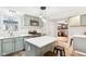 Charming kitchen featuring stainless steel appliances, white countertops, gray cabinets, and island with seating at 455 Meadowview Ln, Greenwood, IN 46142