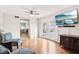 Bright living room with hardwood floors, glass paneled doors and a view to the kitchen at 455 Meadowview Ln, Greenwood, IN 46142