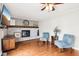 Cozy living room featuring a painted brick fireplace and hardwood floors at 455 Meadowview Ln, Greenwood, IN 46142