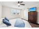 Comfortable main bedroom featuring a barn door and a ceiling fan at 455 Meadowview Ln, Greenwood, IN 46142