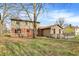 Expansive backyard features a well-maintained lawn, deck, and mature trees that offer shade and privacy at 502 Ironwood Dr, Carmel, IN 46033