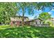 Backyard showing home and a green lawn at 502 Ironwood Dr, Carmel, IN 46033