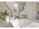 Bathroom featuring a marble countertop, modern faucet, and decorative accents at 502 Ironwood Dr, Carmel, IN 46033