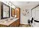 Elegant bathroom with a double vanity, decorative mirrors, and a glass-enclosed shower, creating a spa-like experience at 502 Ironwood Dr, Carmel, IN 46033