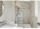 This bathroom features a walk in shower, marbled tile and modern fixtures at 502 Ironwood Dr, Carmel, IN 46033