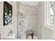 Bathroom shower with marble tile and glass door at 502 Ironwood Dr, Carmel, IN 46033