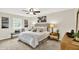 Comfortable bedroom with a bed and a ceiling fan at 502 Ironwood Dr, Carmel, IN 46033