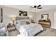 Bedroom with a large bed, lamps, and decor at 502 Ironwood Dr, Carmel, IN 46033