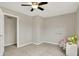 Neutral bedroom with ceiling fan and carpet flooring at 502 Ironwood Dr, Carmel, IN 46033