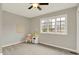 Neutral bedroom with ceiling fan and large window that provides great natural light at 502 Ironwood Dr, Carmel, IN 46033