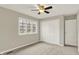 Neutral bedroom with ceiling fan, closet and carpet flooring at 502 Ironwood Dr, Carmel, IN 46033