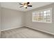 Neutral bedroom with ceiling fan and carpet flooring at 502 Ironwood Dr, Carmel, IN 46033