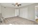 Spacious bedroom with plush carpeting, ceiling fan, and ensuite bathroom access at 502 Ironwood Dr, Carmel, IN 46033