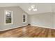 Bright bedroom features hardwood floors, vaulted ceilings, skylight and ample natural light at 502 Ironwood Dr, Carmel, IN 46033