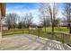 View from wooden deck looking out to backyard with large grassy lawn and mature trees in background at 502 Ironwood Dr, Carmel, IN 46033