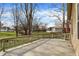 Wooden deck overlooks a large backyard with mature trees; nice spot for entertaining and grilling at 502 Ironwood Dr, Carmel, IN 46033