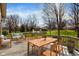 The outdoor deck has a wooden table and chairs, and an outdoor sofa, perfect for entertaining at 502 Ironwood Dr, Carmel, IN 46033