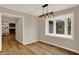 Dining room featuring stylish light fixture and a window overlooking the outdoors at 502 Ironwood Dr, Carmel, IN 46033