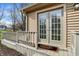 Charming entrance with glass paneled doors and a 'Welcome' mat, leading to a cozy and inviting home at 502 Ironwood Dr, Carmel, IN 46033