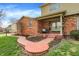 Inviting home entrance with a brick walkway, covered porch, and well-maintained landscaping, creating a warm welcome at 502 Ironwood Dr, Carmel, IN 46033