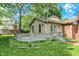 Charming home featuring a cozy deck, French doors, brick details and a lush green lawn at 502 Ironwood Dr, Carmel, IN 46033