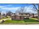 Classic two-story home with a well-kept lawn, brick accents, and mature trees, offering great curb appeal at 502 Ironwood Dr, Carmel, IN 46033