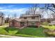 Charming two-story home featuring a well-manicured lawn, brick accents, and mature trees, creating a welcoming facade at 502 Ironwood Dr, Carmel, IN 46033