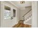 Foyer with a beautiful front door and natural wood flooring at 502 Ironwood Dr, Carmel, IN 46033
