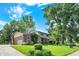 Beautifully landscaped two-story home with a brick facade, attached garage, and verdant lawn at 502 Ironwood Dr, Carmel, IN 46033