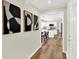Hallway with wood floors that leads to the kitchen at 502 Ironwood Dr, Carmel, IN 46033