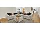 Spacious living room with a comfortable sectional sofa offering a relaxing atmosphere for entertaining at 502 Ironwood Dr, Carmel, IN 46033