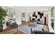 Stylish living room with hardwood floors, ample natural light, and contemporary furnishings at 502 Ironwood Dr, Carmel, IN 46033