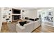 Bright living room featuring a red brick fireplace with decorative shelving and a comfortable sectional sofa at 502 Ironwood Dr, Carmel, IN 46033