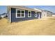 New home with a sodded backyard and a small patio area at 5145 Cartland Dr, Indianapolis, IN 46239