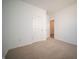 Cozy bedroom with neutral carpet, clean white walls, and a view to another room at 5145 Cartland Dr, Indianapolis, IN 46239