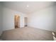 This spacious bedroom boasts plush carpet and multiple door entrances at 5145 Cartland Dr, Indianapolis, IN 46239