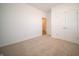 A bright bedroom with neutral carpet, white walls, and a double door closet at 5145 Cartland Dr, Indianapolis, IN 46239