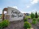 Fields at New Bethel community sign surrounded by landscaping and greenery at 5145 Cartland Dr, Indianapolis, IN 46239