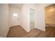 Bright entryway featuring hardwood floors, a white front door, and an open doorway at 5145 Cartland Dr, Indianapolis, IN 46239